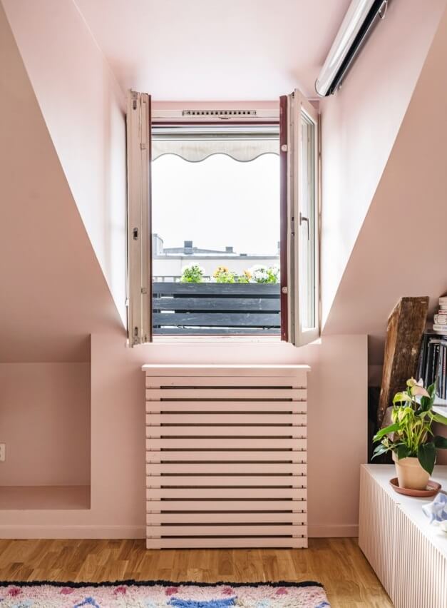 A Small, Colorful Attic Apartment with A Yellow Kitchen 8 pink room with access to tiny outdoor space