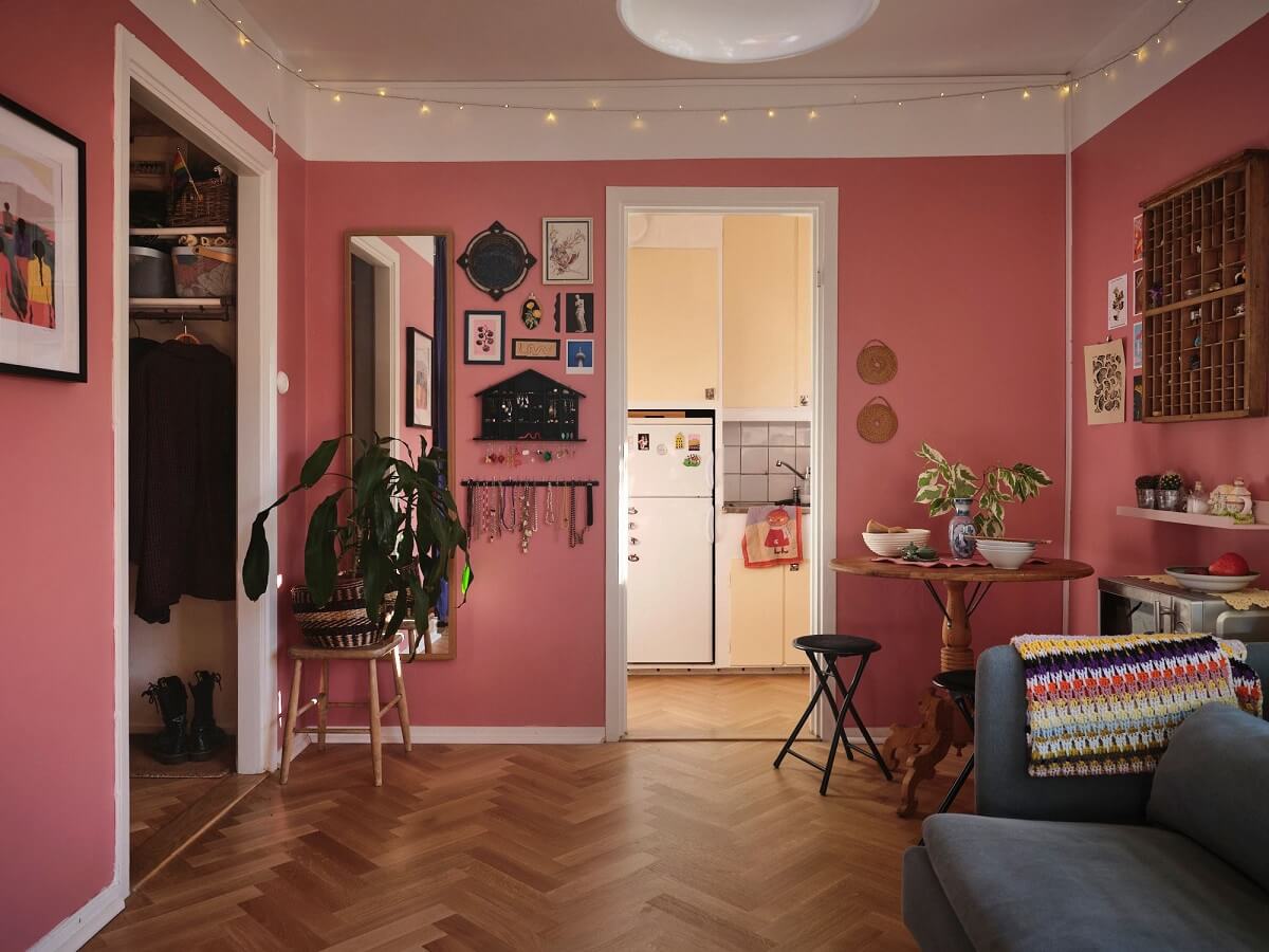 A Bold Pink Studio Apartment with a Light Yellow Kitchen 7 pink studio apartment with herringbone parquet floor