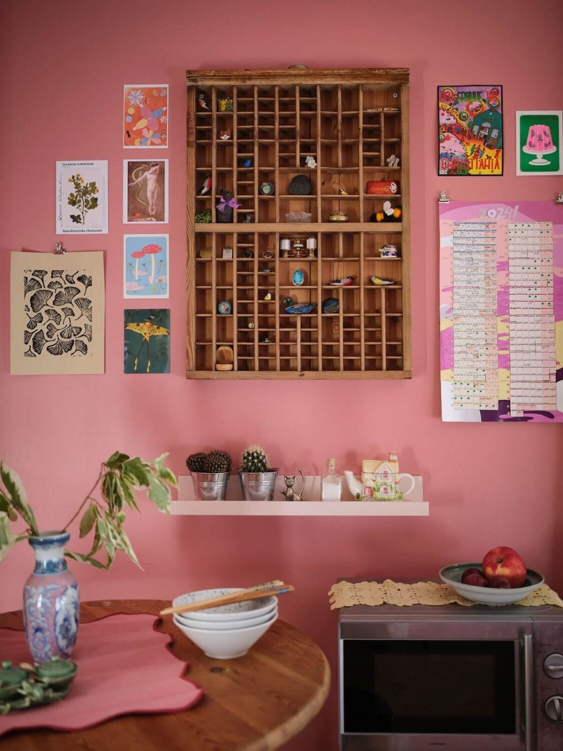 A Bold Pink Studio Apartment with a Light Yellow Kitchen 9 pink studio detail