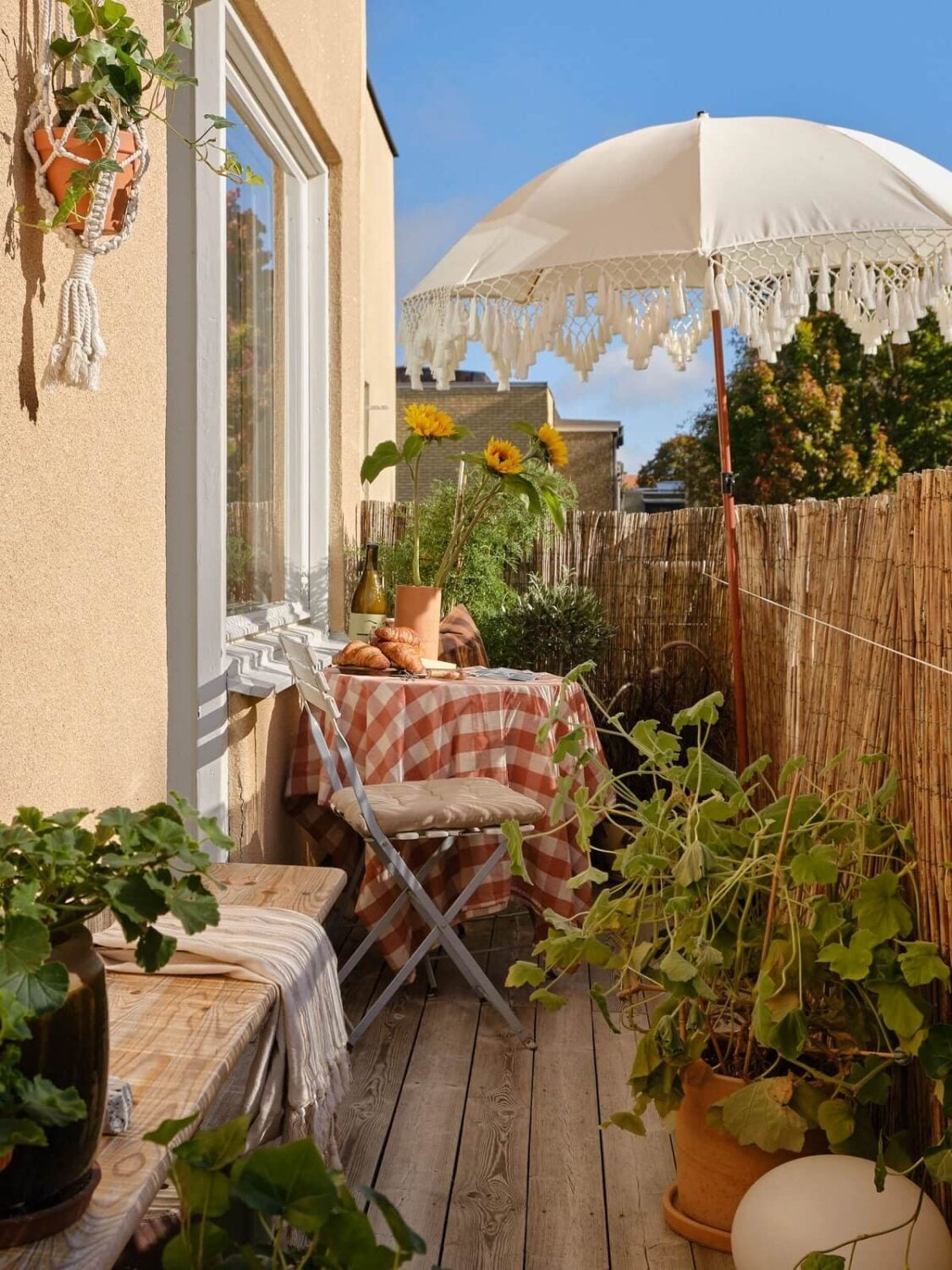 A Beautiful Calm and Natural Apartment with a Green Kitchen 13 plant filled balcony