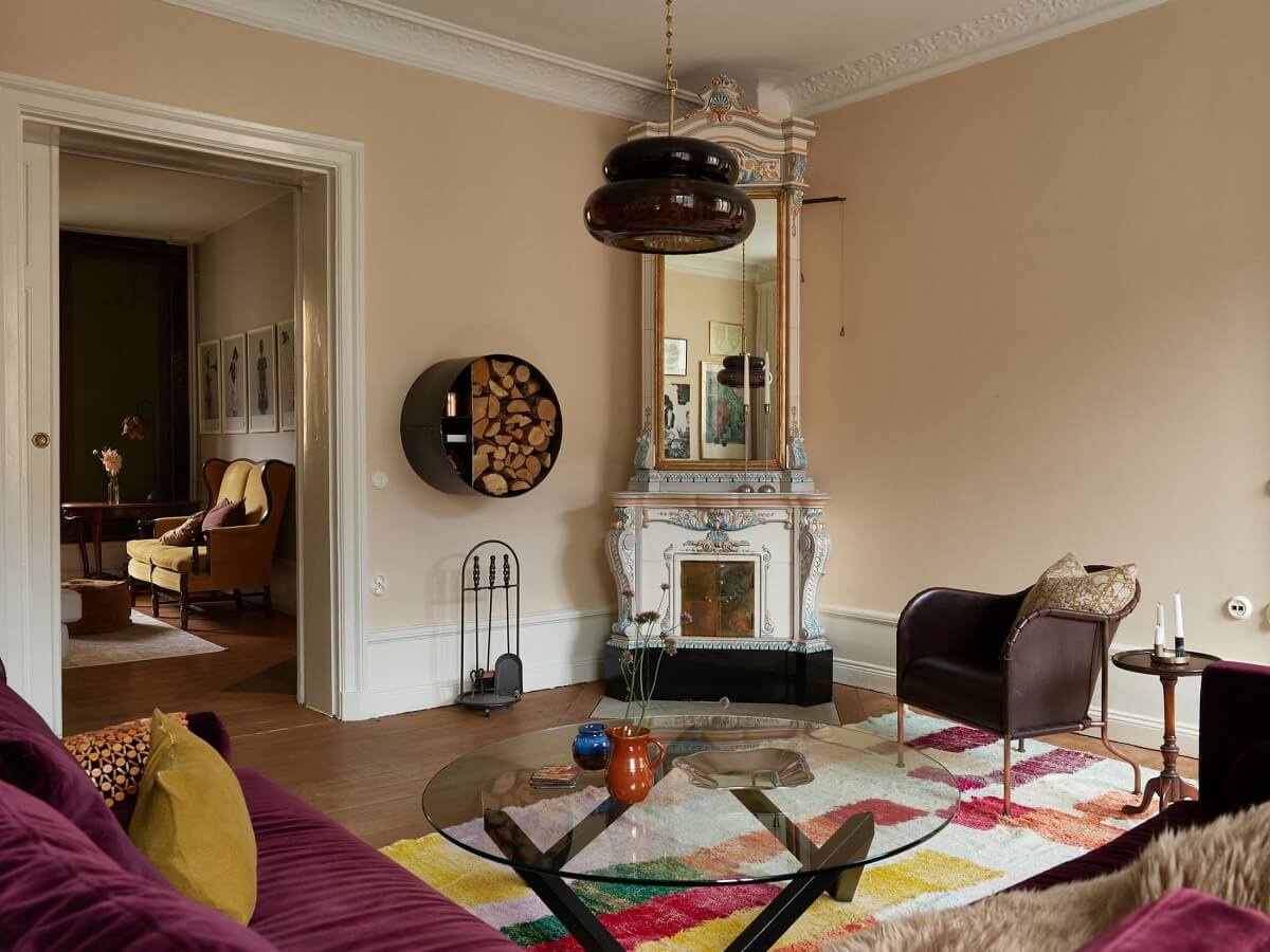 Beautiful Historic Details in a Large and Inviting Family Apartment 3 purple sofa living room ornate fireplace