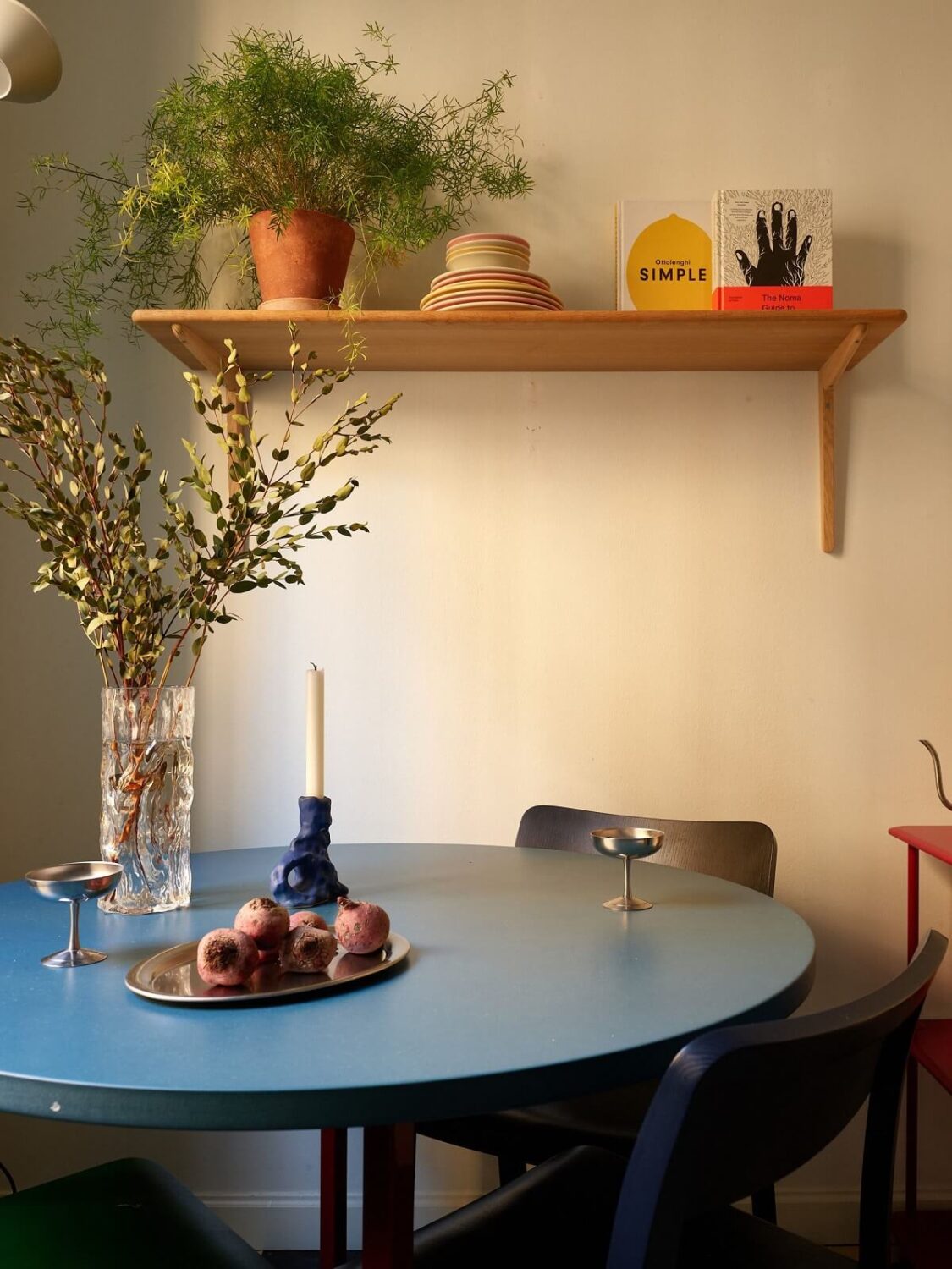 Golden Yellow Walls in a Colorful Swedish Studio Apartment 14 round blue kitchen table