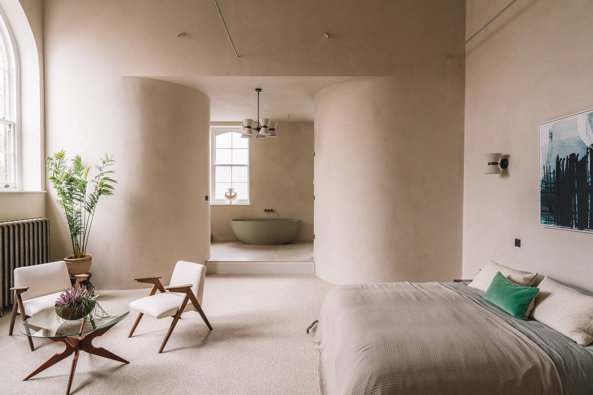 Contemporary Interiors with Limewash Walls in an Old School Building 13 rounded shaped in large bedroom