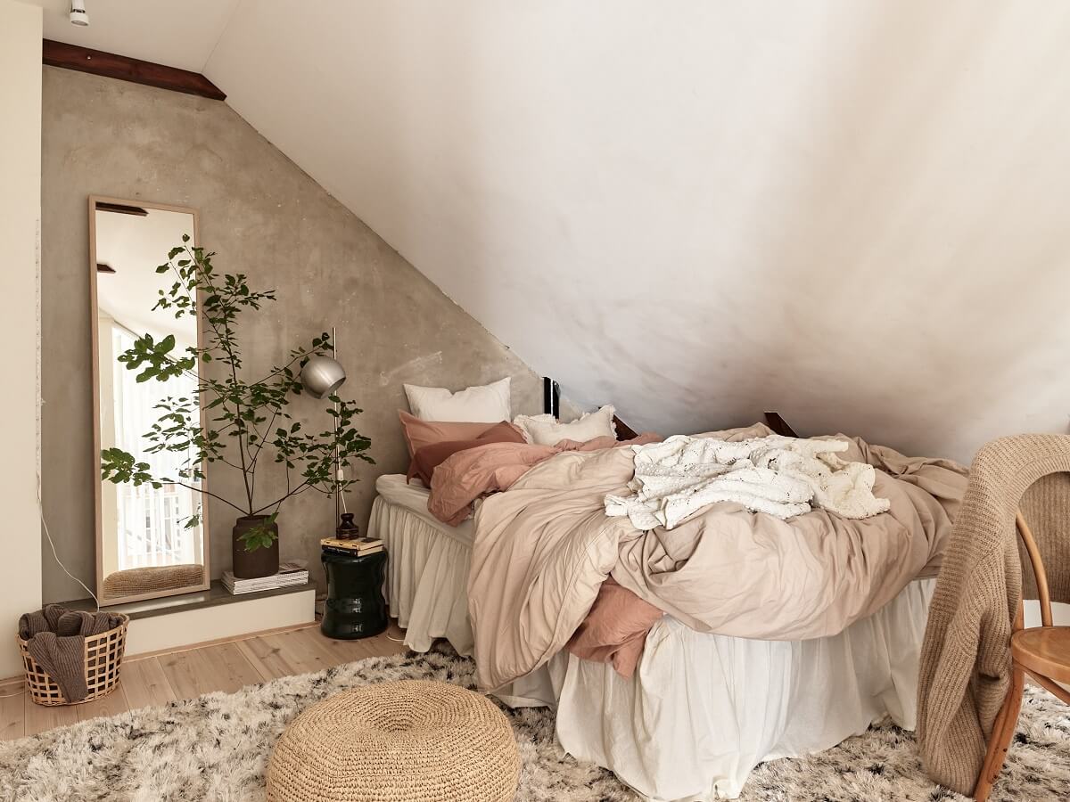A Light Two-Bedroom Attic Apartment in Sweden 14 scandi attic bedroom gray wall