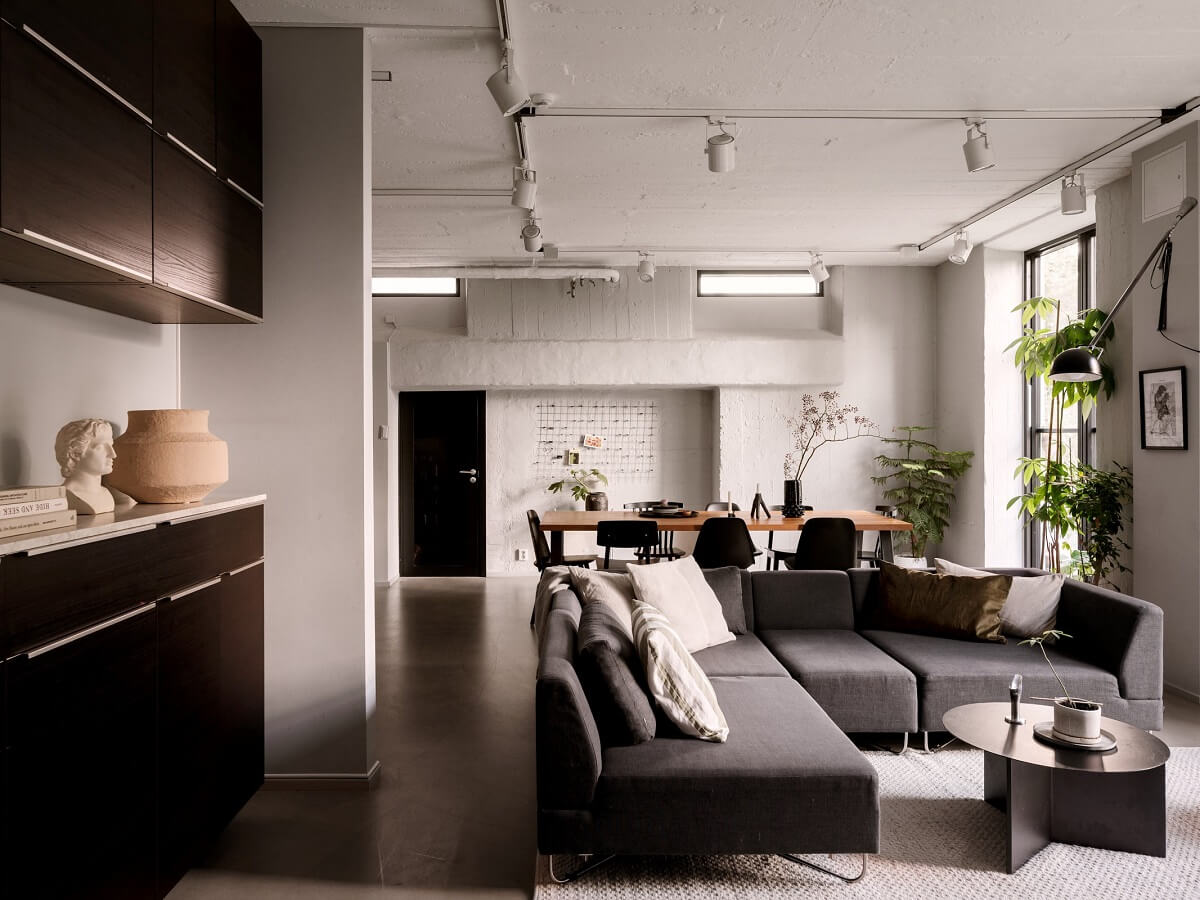 A Modern Industrial Basement Apartment in Sweden 5 scandi living room corner sofa