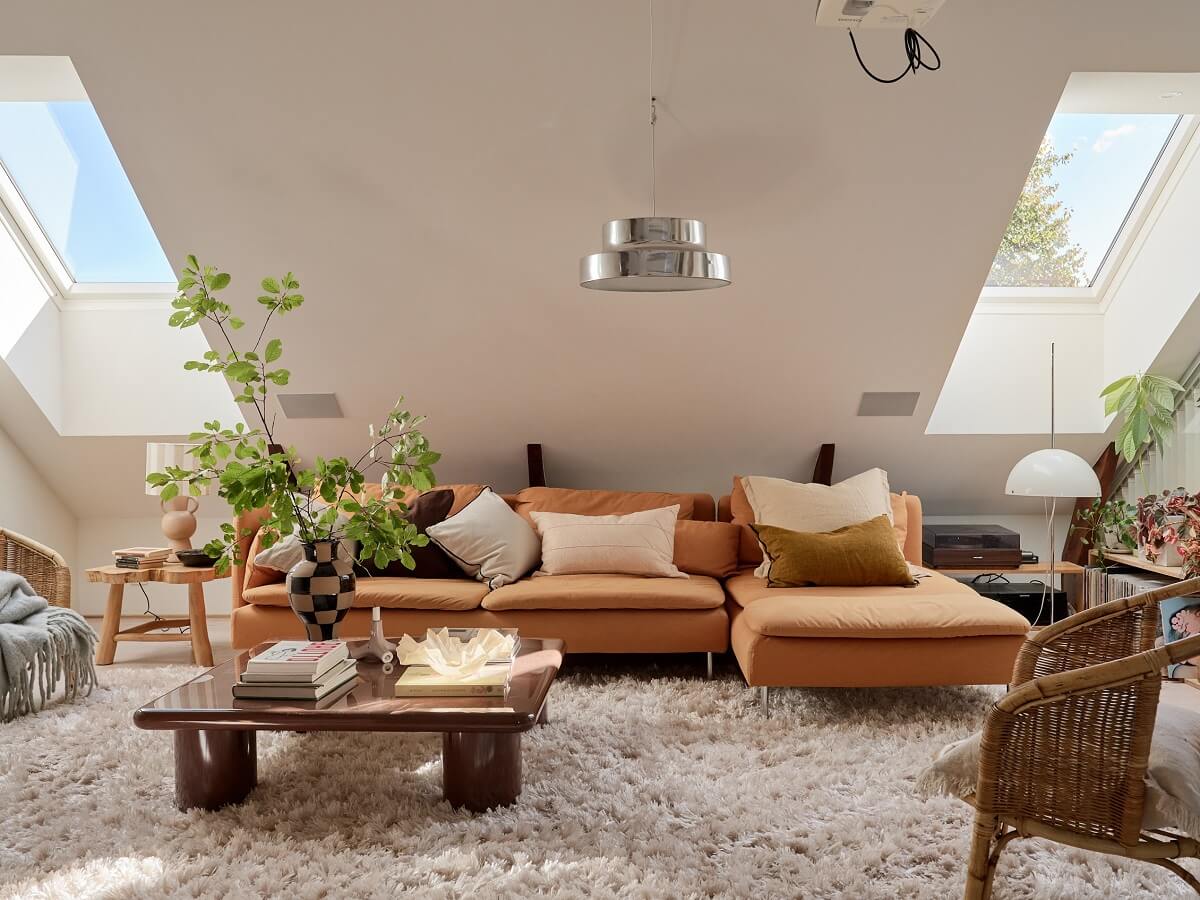 A Light Two-Bedroom Attic Apartment in Sweden 2 scandi living room slanted ceiling