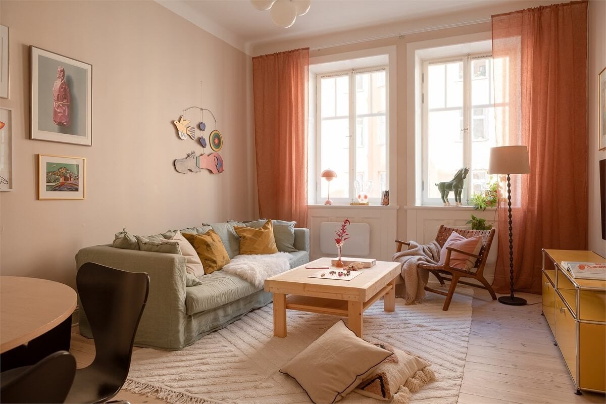 Nature-Inspired Colors in a Charming Stockholm Apartment 1 scandi living room warm color curtains