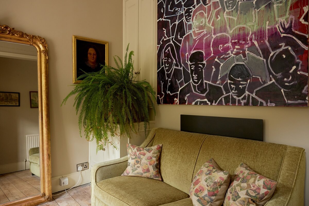 Muted Tones and an Orangery in a Victorian Coastal House 11 sitting room with green sofa