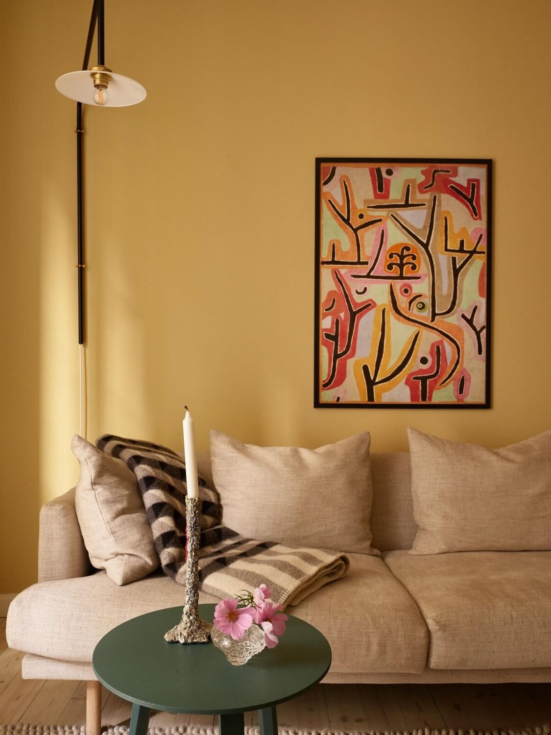 Golden Yellow Walls in a Colorful Swedish Studio Apartment 3 sitting warm yellow studio