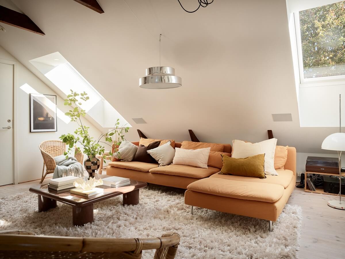 A Light Two-Bedroom Attic Apartment in Sweden 3 slanted ceiling living room
