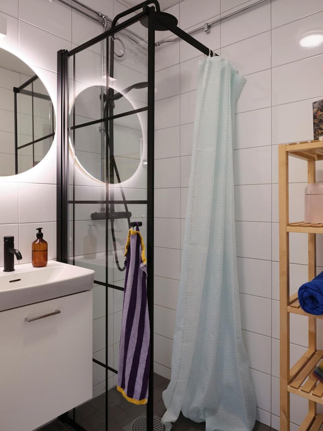 A Bold Pink Studio Apartment with a Light Yellow Kitchen 13 small bathroom with industrial style shower glass