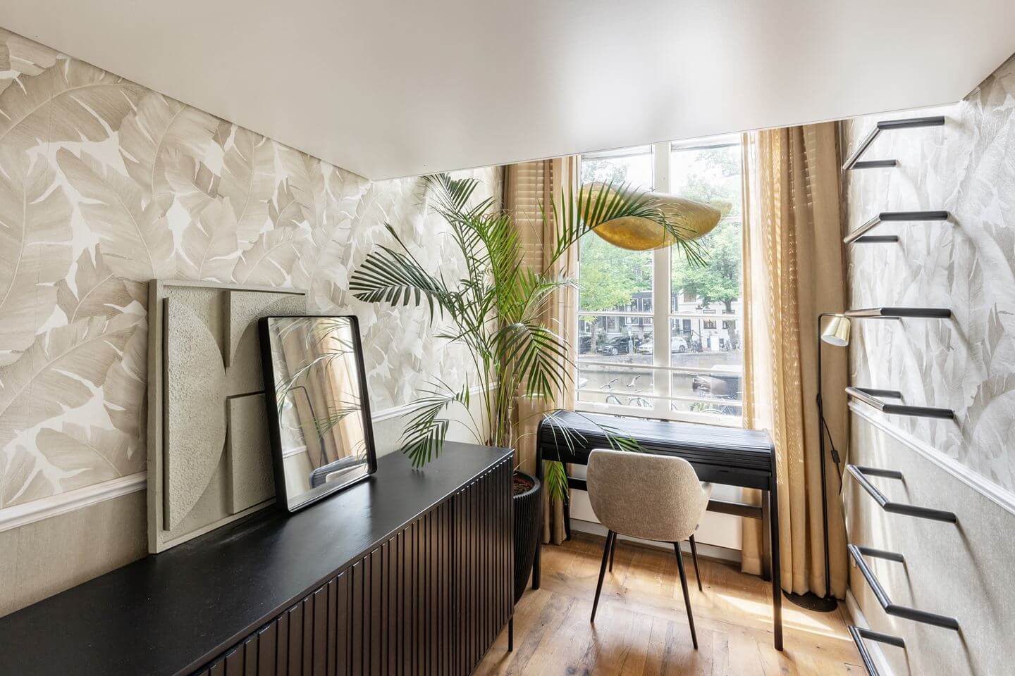 Hotel-Style Interiors in an Amsterdam Canal House 12 small bedroom with wallpaper desk and loft bed