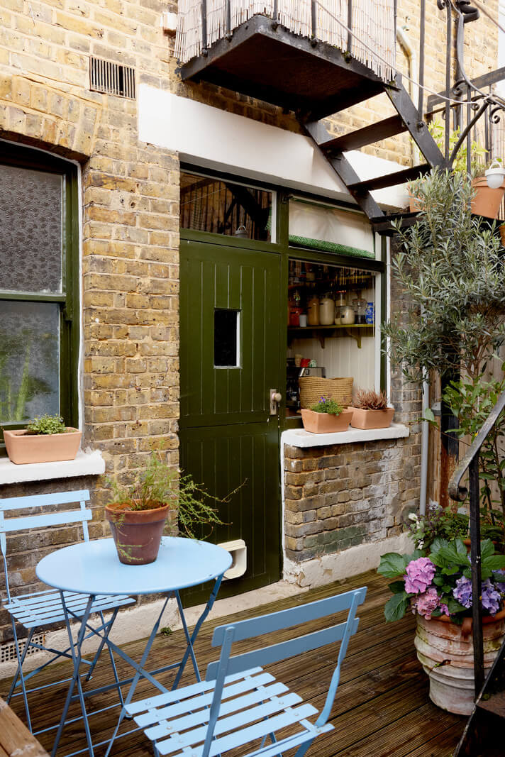 A Beautiful Color Palette in a Victorian London Apartment 18 small outdoor space bistro seating green door