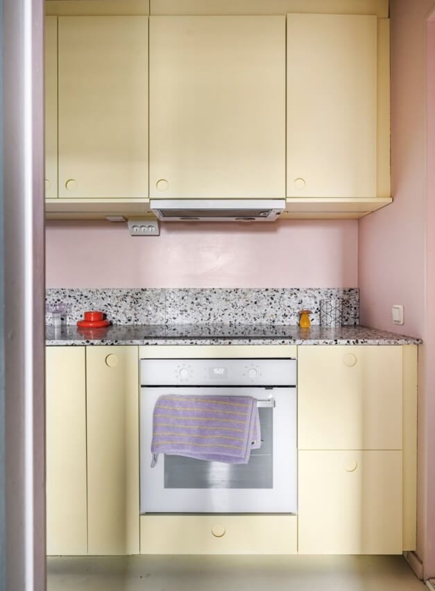 A Small, Colorful Attic Apartment with A Yellow Kitchen 12 small yellow kitchen