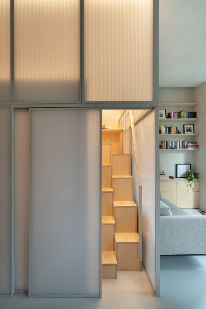 An Award-Winning Shoji-Inspired Loft Apartment in London 11 staircase hidden by sliding door