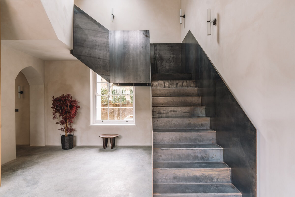 Contemporary Interiors with Limewash Walls in an Old School Building 18 steel staircase