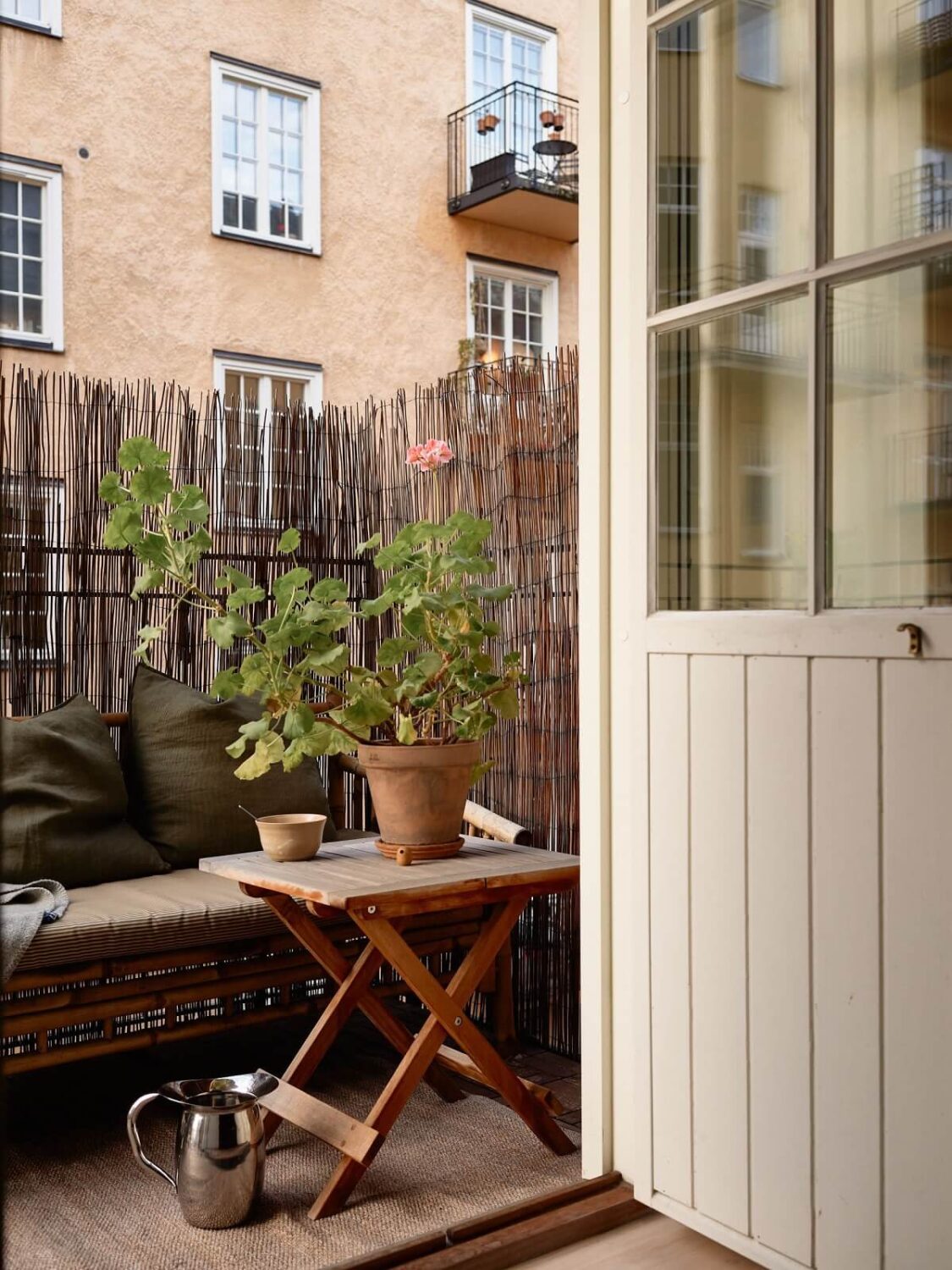 Golden Yellow Walls in a Colorful Swedish Studio Apartment 9 studio apartment balcony