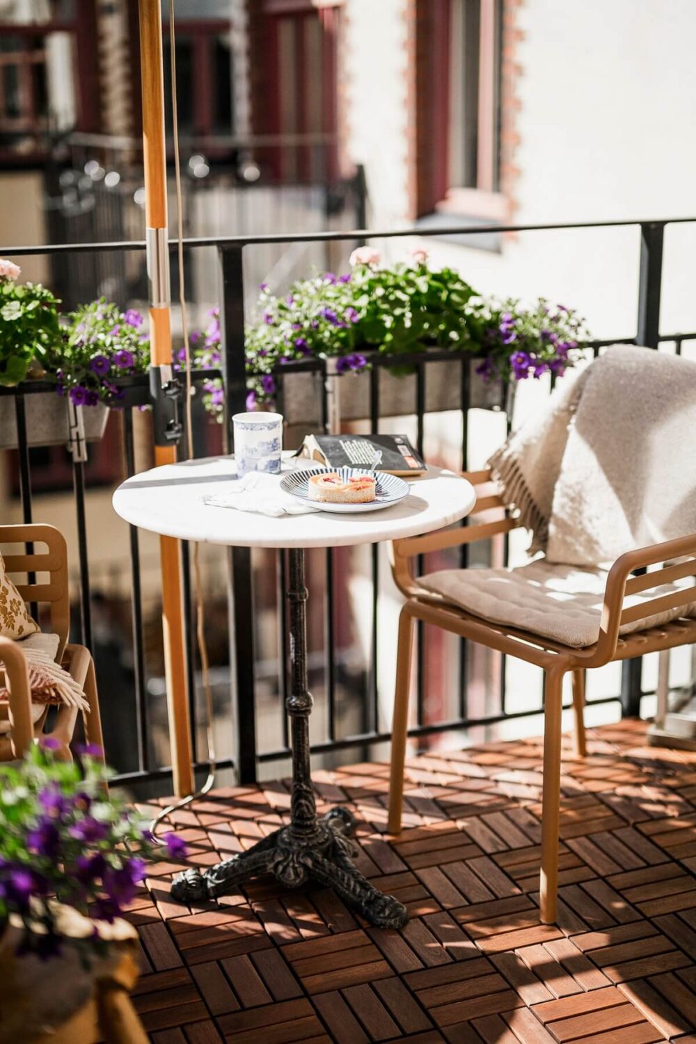 Hannes Mauritzson's Warm Yellow Hygge Apartment in Sweden 34 sunny balcony with ikea floor