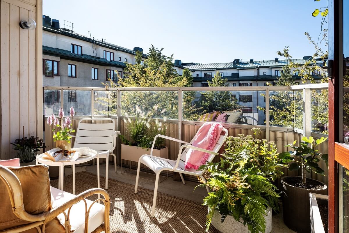 A Light and Modern Stockholm Apartment with Cheerful Color Accents 10 sunny balcony