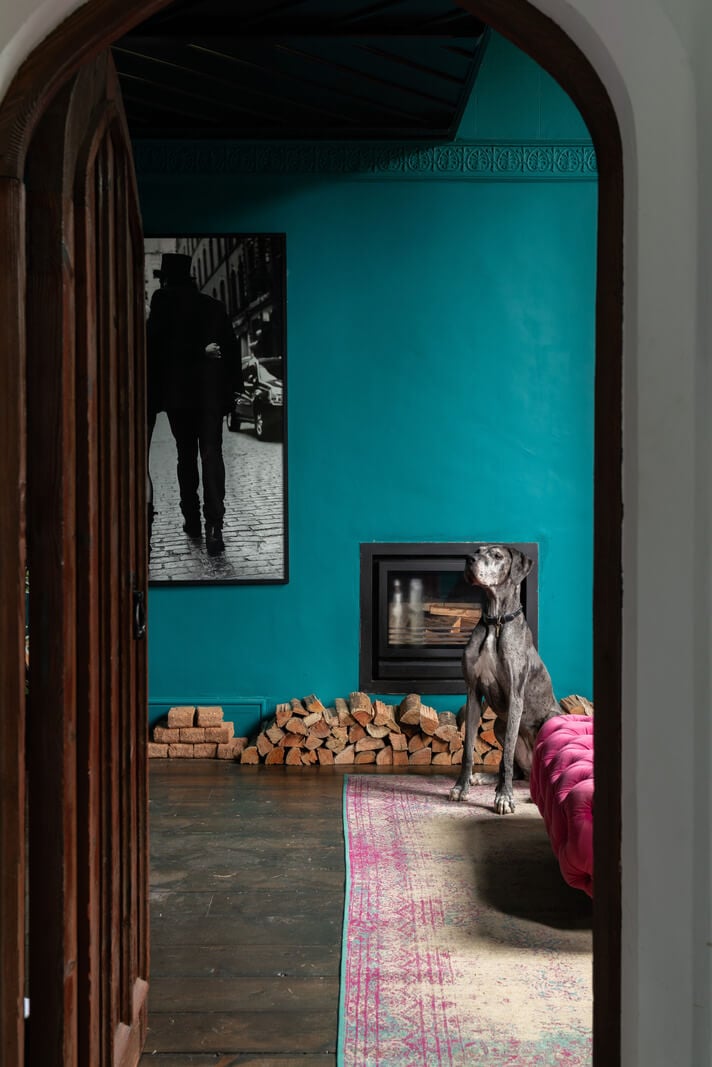 A Colorful Gothic-Style School Conversion in England 6 teal green living room