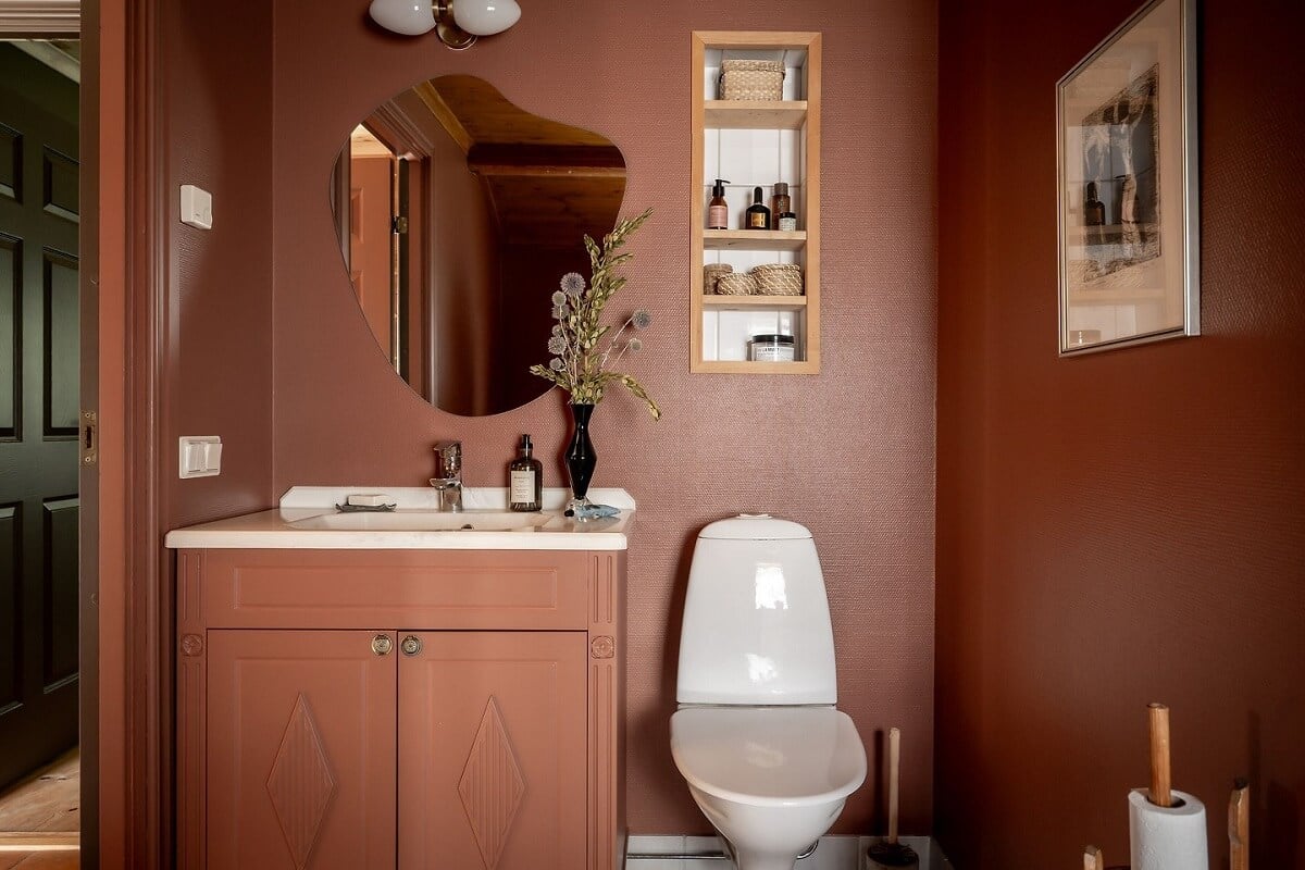A Warm Scandinavian Log House with a Green Roof 21 terracotta orange bathroom
