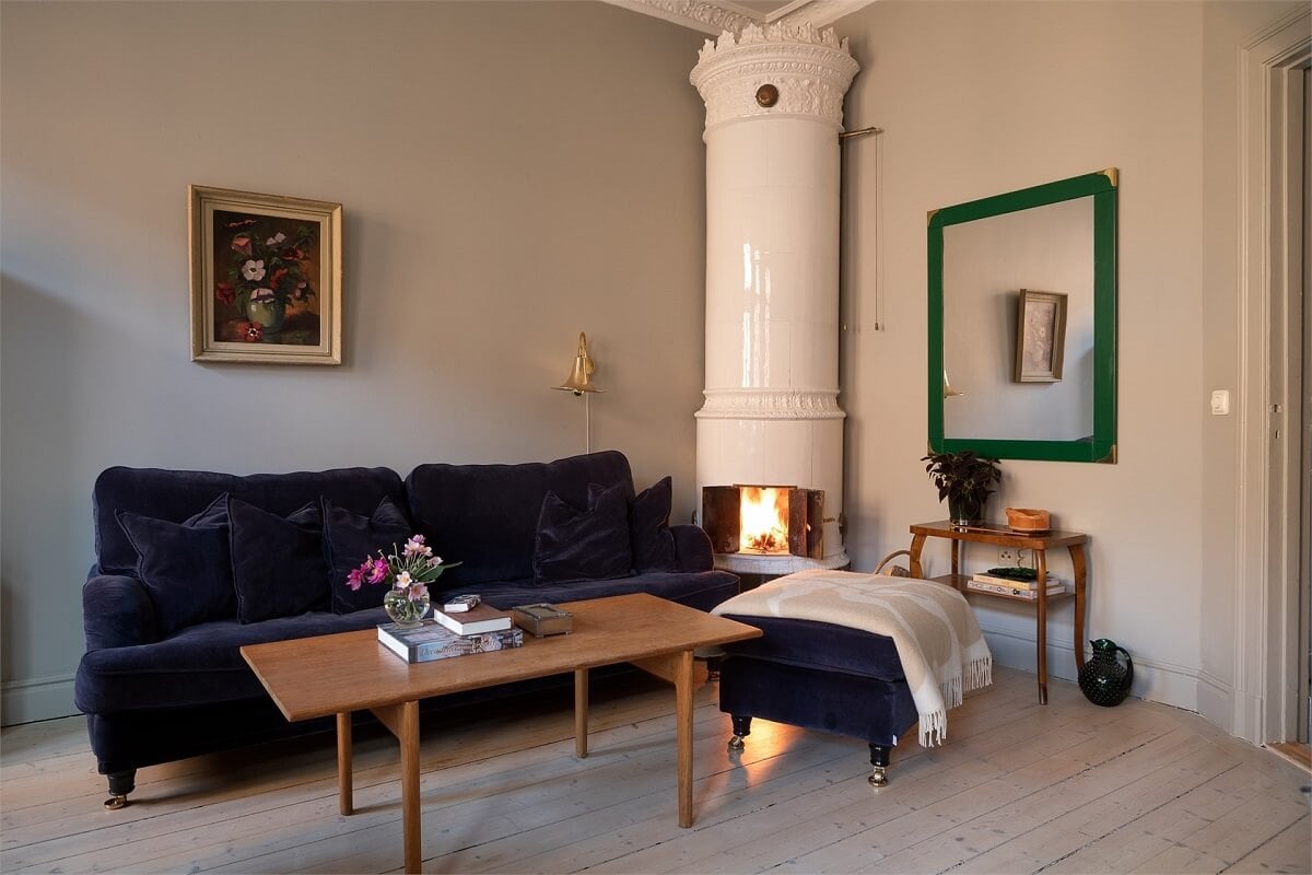 A Turn-of-the-Century Apartment with a Dark Blue Bedroom - Revisited 3 velvet sofa fireplace gray living room