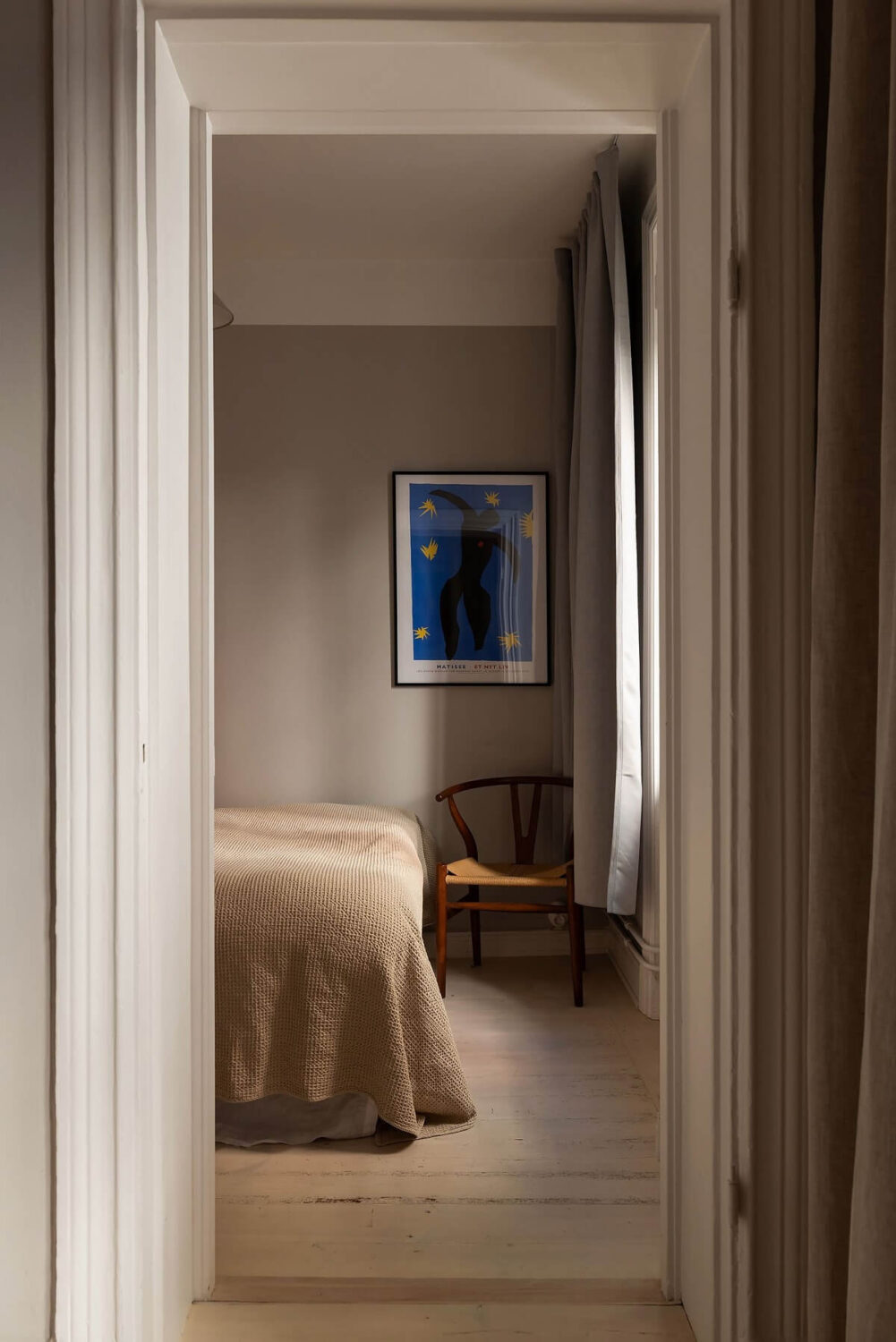 Sober Colors in a Small Renovated Stockholm Apartment 15 view into bedroom