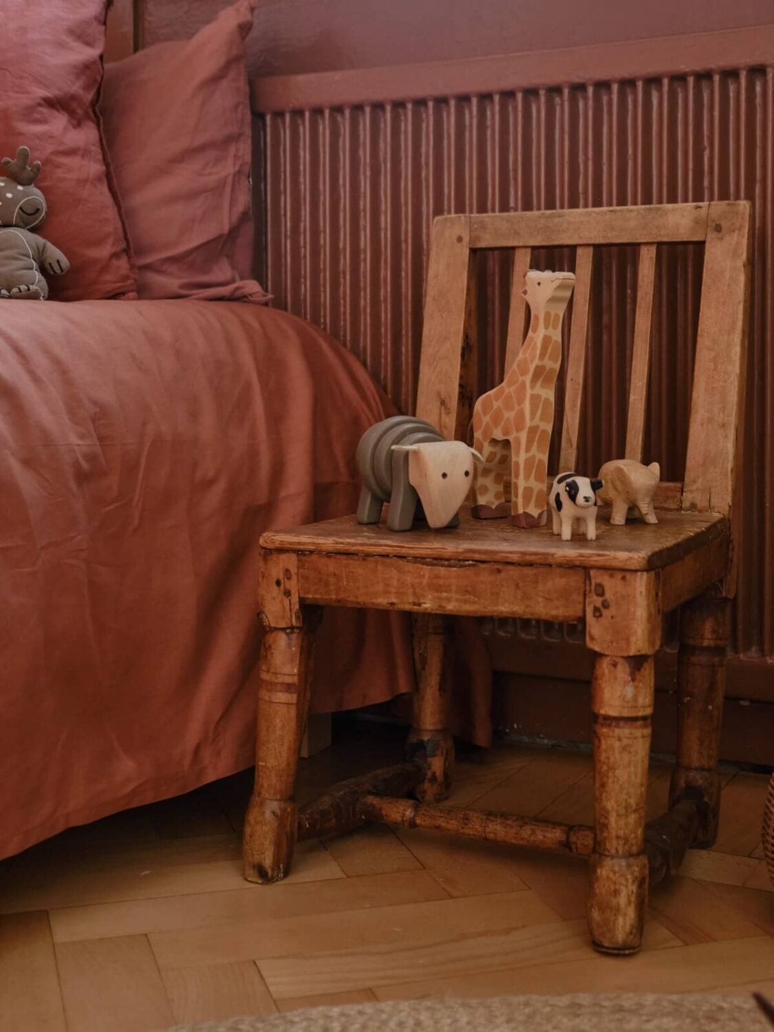 A Beautiful Calm and Natural Apartment with a Green Kitchen 22 vintage wooden chair as nightstand A Beautiful Calm and Natural Apartment with a Green Kitchen