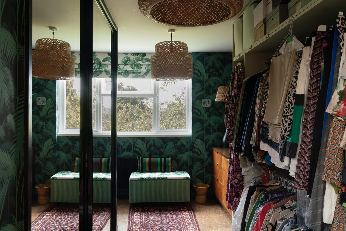 A Beautiful Mid-Century House in London 14 walk in closet with green tropical wallpaper A Beautiful Mid-Century House in London