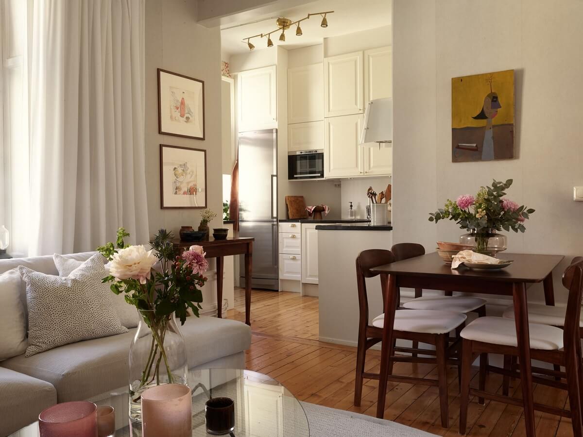 Period Features and Light Colors in a One-Bedroom Apartment 5 warm open plan living room wooden floor