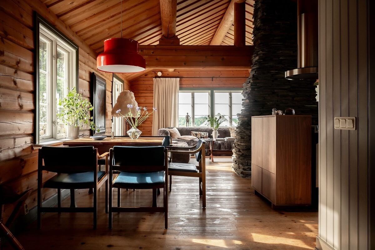 A Warm Scandinavian Log House with a Green Roof 10 warm wooden open plan kitchen living room