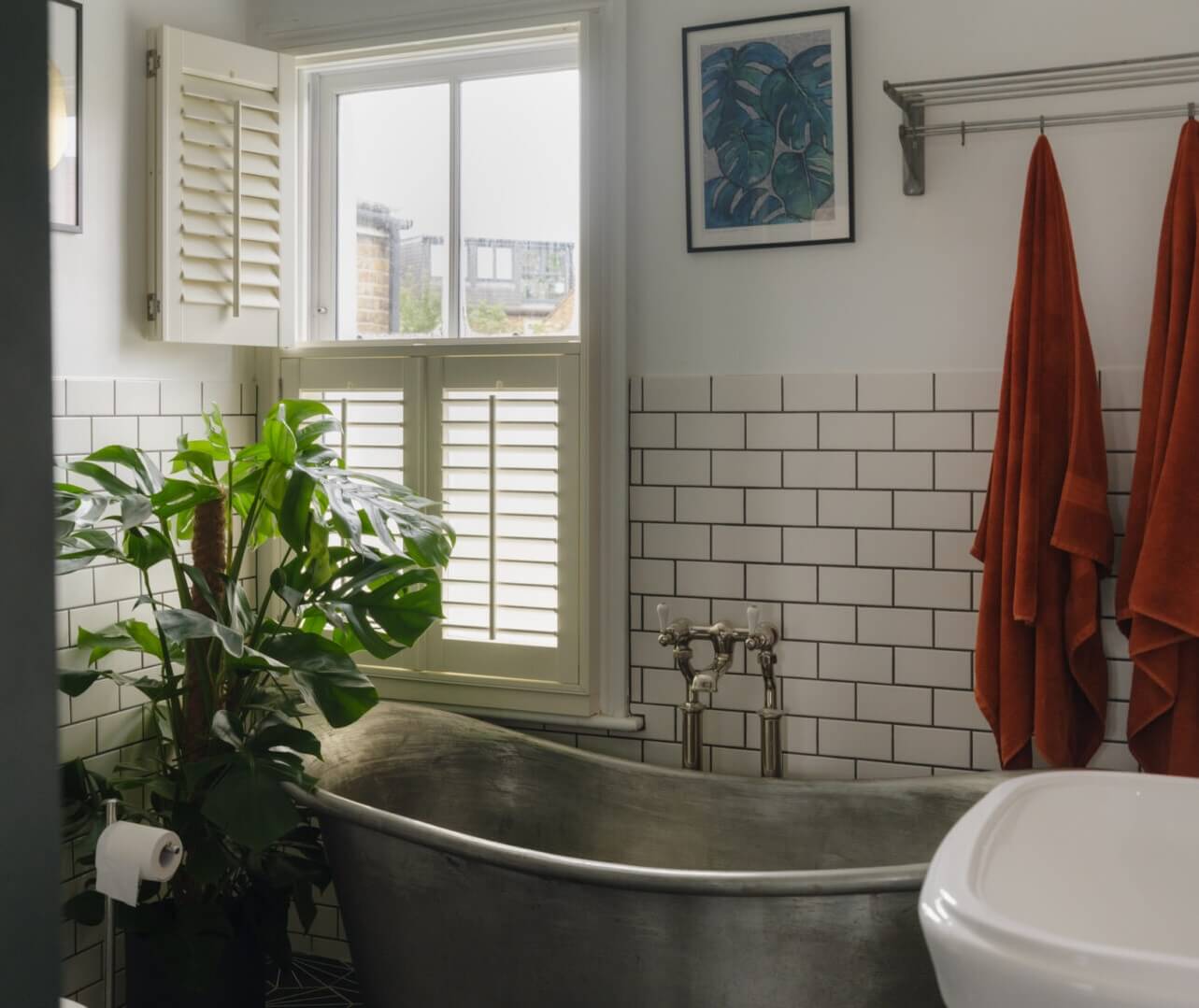 Nature-Inspired Colors in an Extended East London Home 15 white bathroom with freestanding bath