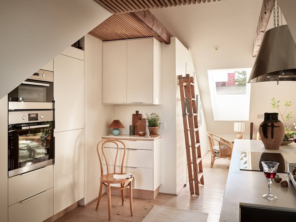 A Light Two-Bedroom Attic Apartment in Sweden 6 white kitchen attic apartment