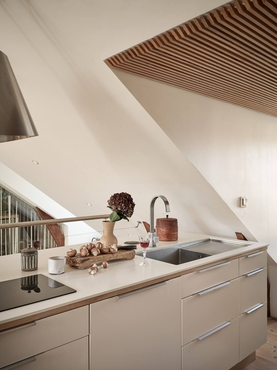 A Light Two-Bedroom Attic Apartment in Sweden 7 white scandi kitchen