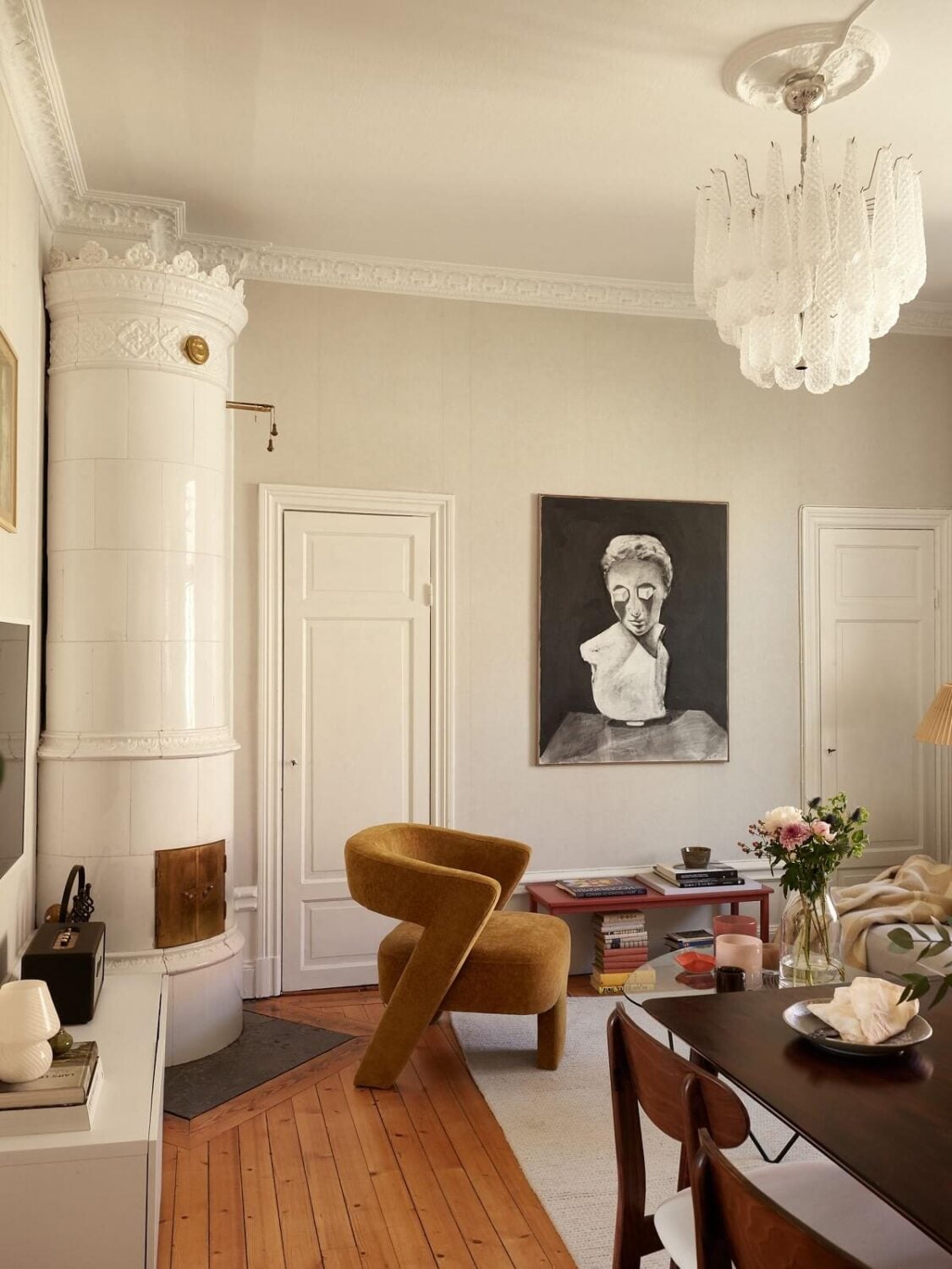Period Features and Light Colors in a One-Bedroom Apartment 2 wooden floorboards living room yellow chair