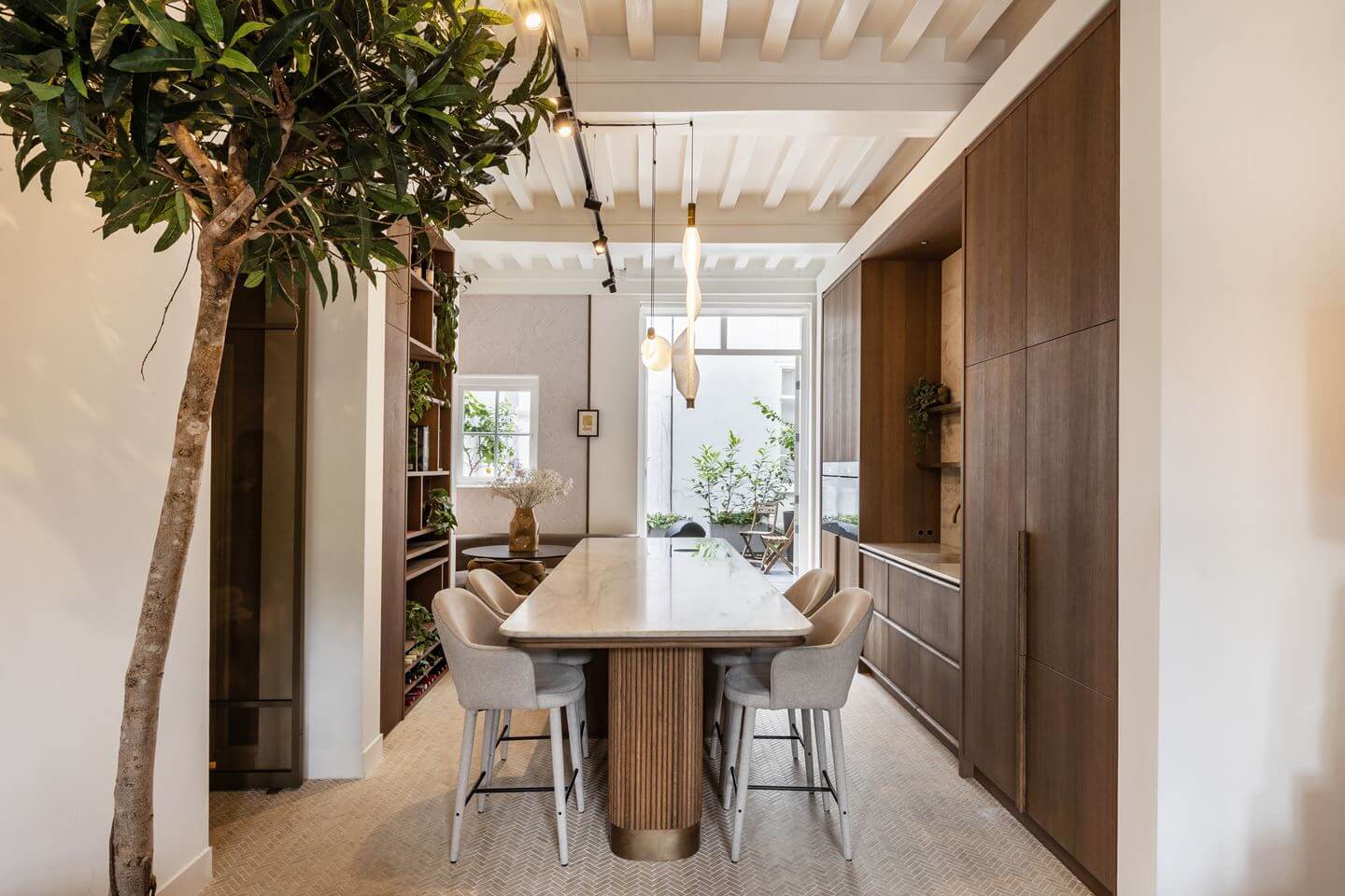 Hotel-Style Interiors in an Amsterdam Canal House 5 wooden kitchen with combined island and table