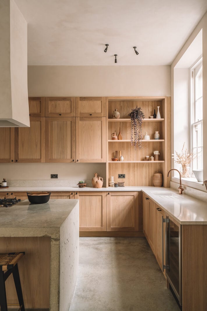 Contemporary Interiors with Limewash Walls in an Old School Building 3 wooden kitchen with open cabinet in the corner