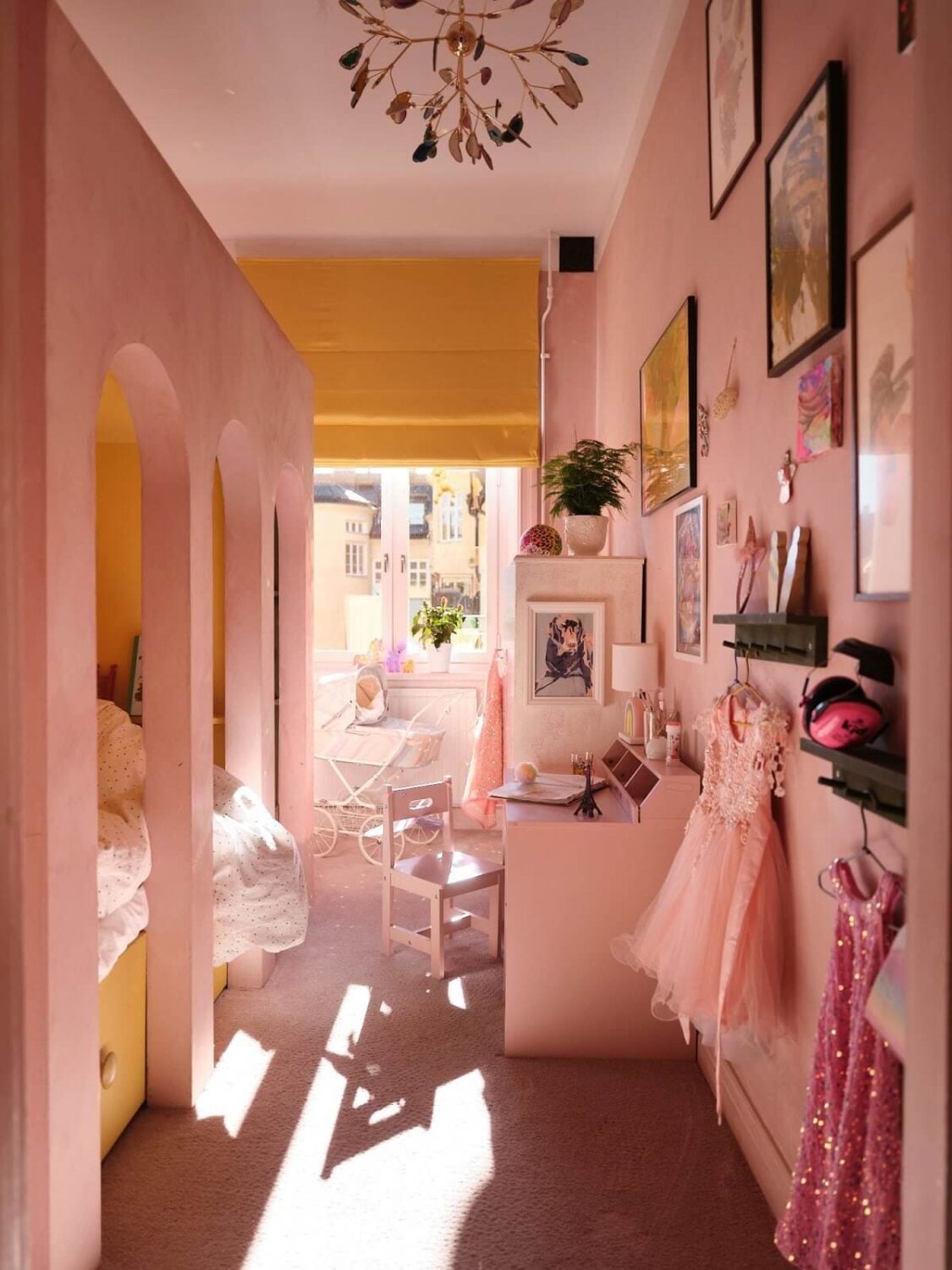 yellow and pink childrens bedroom with loft bed nordroom