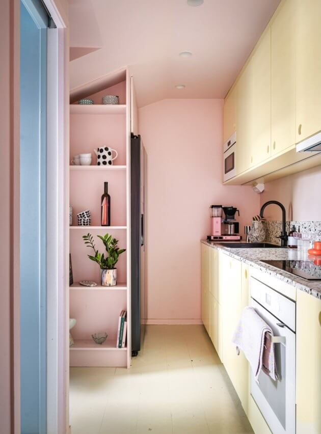 A Small, Colorful Attic Apartment with A Yellow Kitchen 14 yellow kitchen cabinets