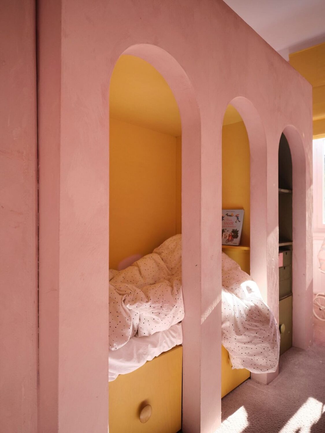 A Light Pastel Yellow and Pink Apartment in Stockholm 21 yellow pink kids bedroom with custom bunk bed