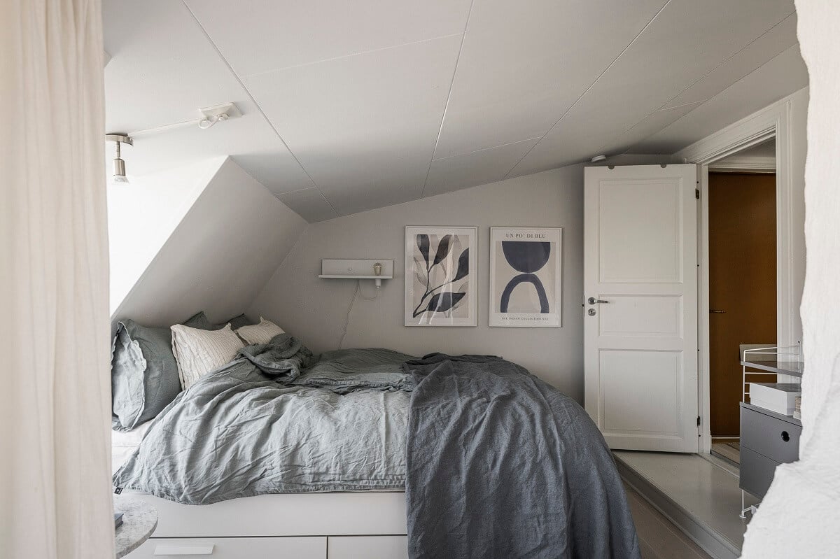 A Swedish Attic Apartment with a Lovely Balcony Overlooking the City 17 attic bedroom low ceiling