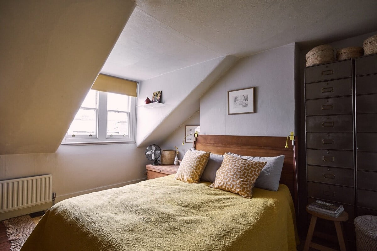 A Grand Victorian House with Many Period Features and a Lush Garden 26 attic bedroom yellow bedding