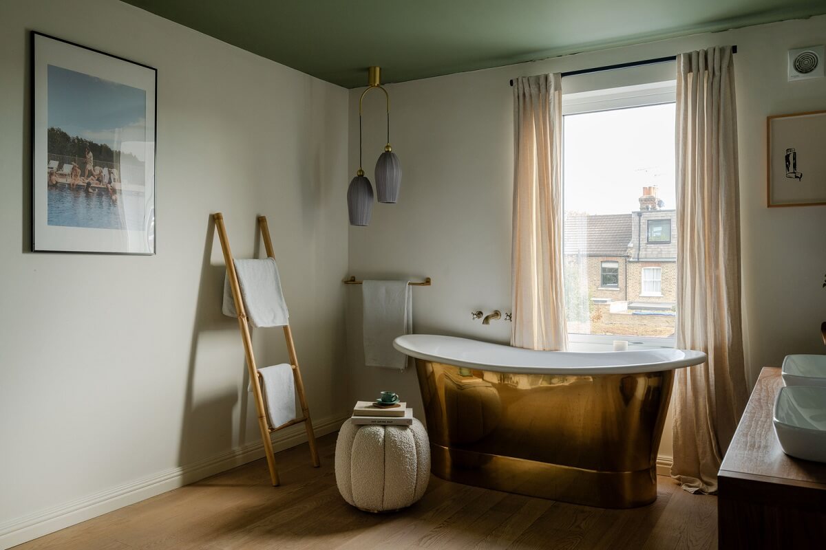 A Colorful Edwardian Family Home in London 16 bathroom green ceiling brass tub