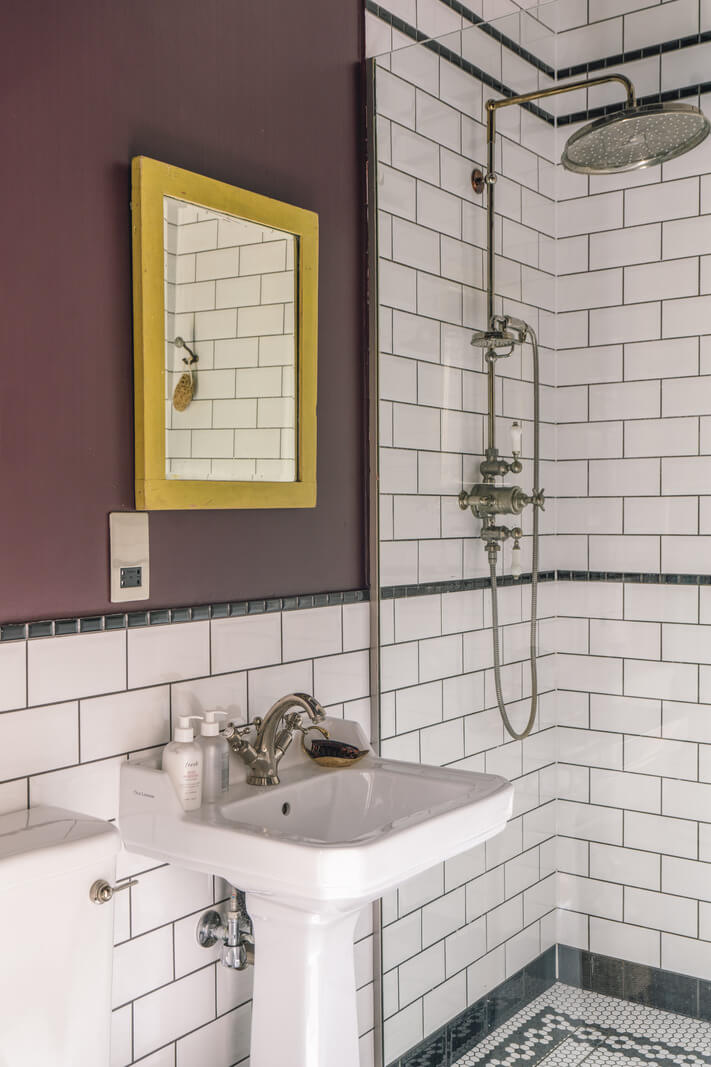 A Grand Ground Floor Apartment with Dark Blue Walls and a Garden 14 bathroom with purple wall and classic black and white tiles nordroom