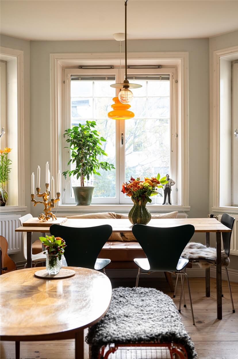 Green Tones in a Turn-of-the-Century Stockholm Apartment 4 bay window with dining table