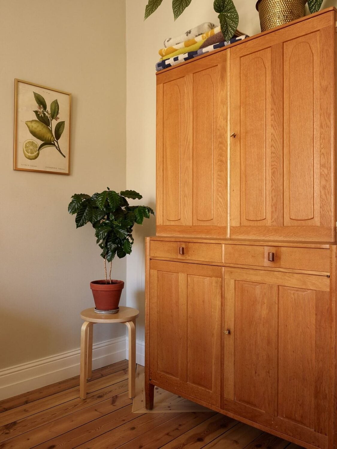 A Light Turn-of-the-Century Apartment with a Cheerful Color Palette 16 bedroom detail wooden floor