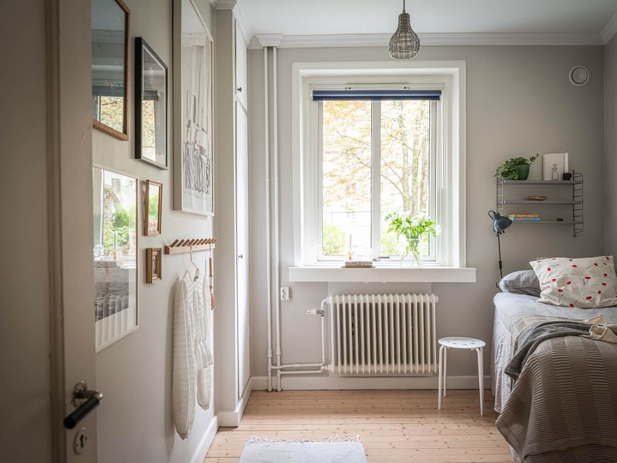 A 1930s Apartment with Gray Rooms and Period Features 15 bedroom light gray walls wooden floor