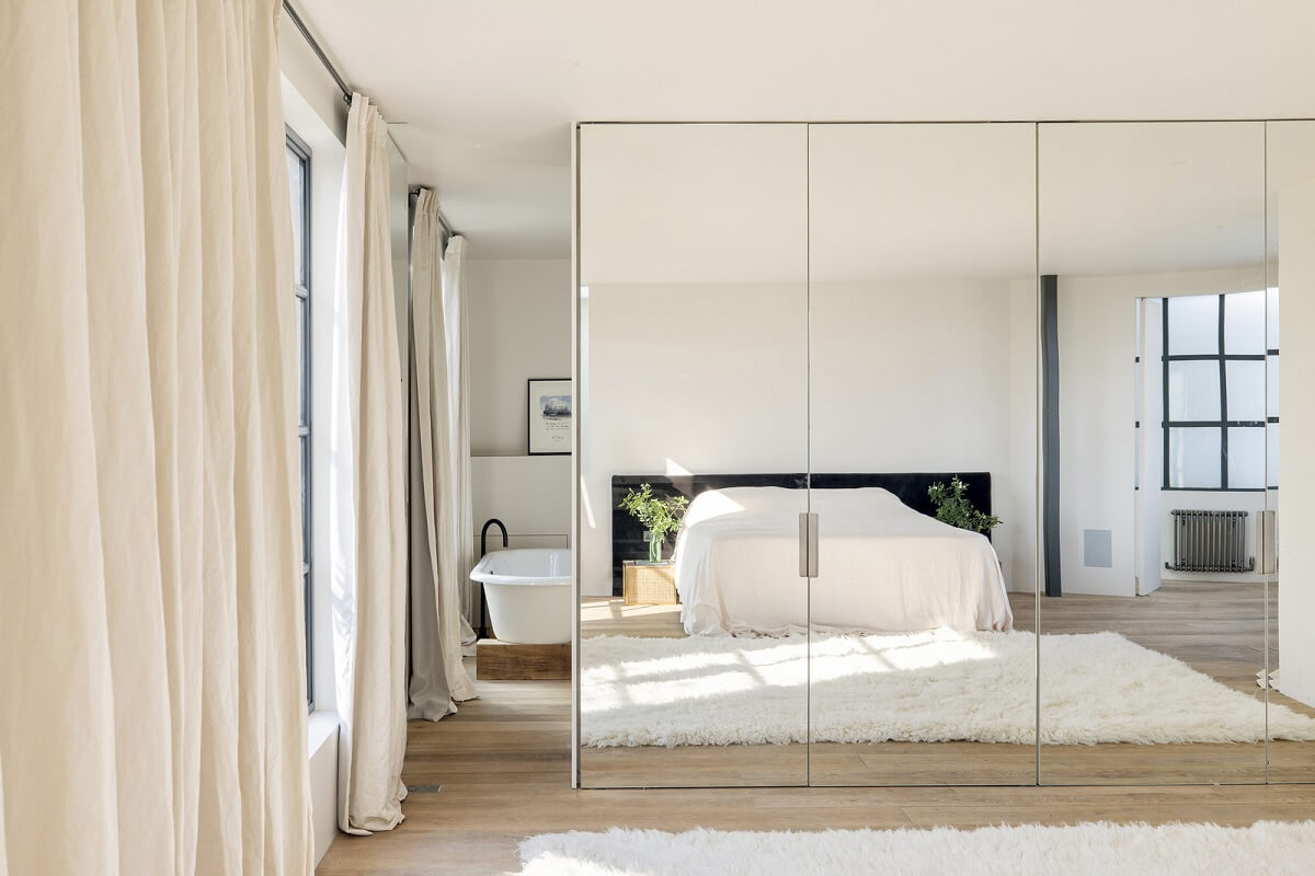 A Grand Industrial Warehouse Conversion in London 34 bedroom mirror front wardrobes
