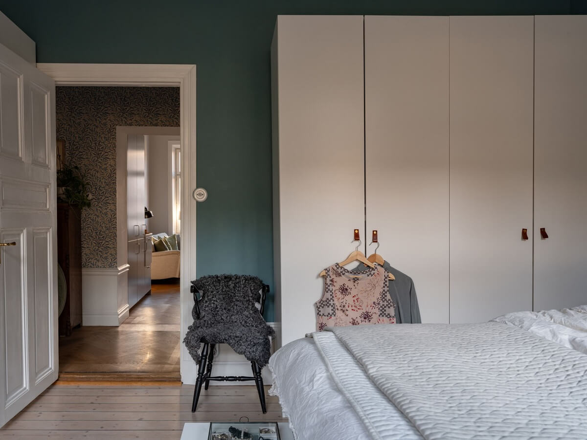 An 1890s Stockholm Apartment with a Blue Bedroom 14 bedroom teal blue walls white wardrobes