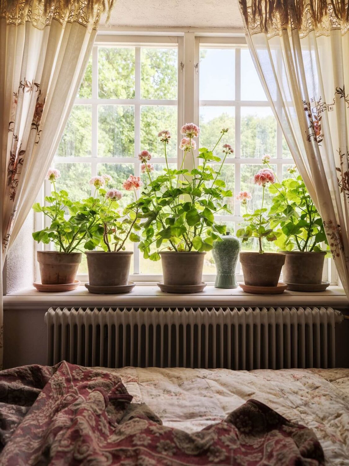 A Bohemian-Style House on the Estate of a Swedish Castle 13 bedroom window plants